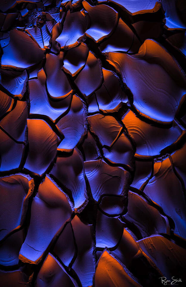 Subtle light and natural earth tones meet in this abstract fine art print from Capitol Reef. “Wild Embers” reveals glowing textures and ember-like cracks—perfec