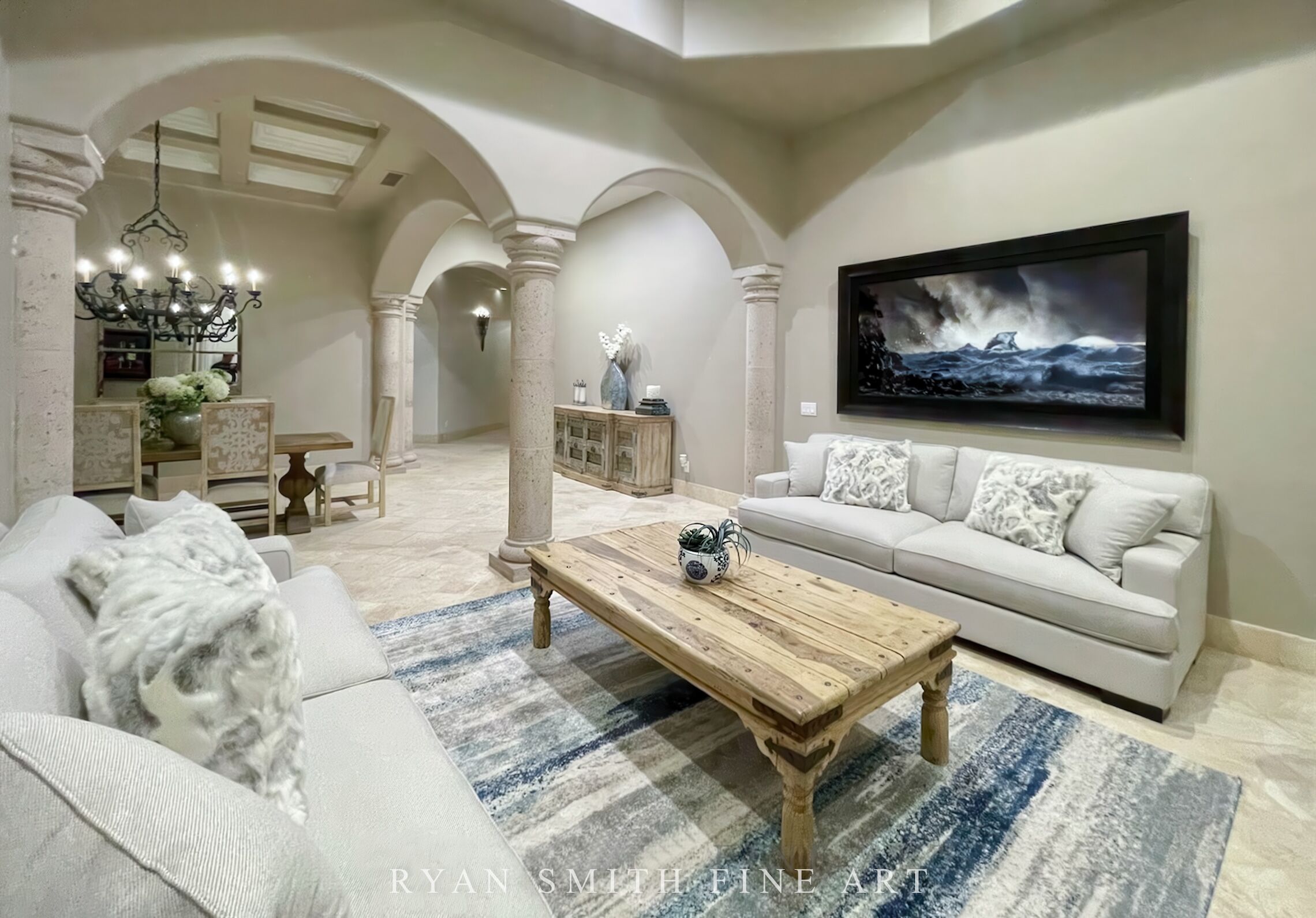 Framed fine art ocean wave and storm print in elegant Mediterranean-style living room